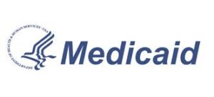 The image displays the Medicaid logo in blue against a white background. To the left of the word "Medicaid," there is a circular emblem with the text "DEPARTMENT OF HEALTH & HUMAN SERVICES - USA" surrounding a stylized symbol of a bird-like figure.